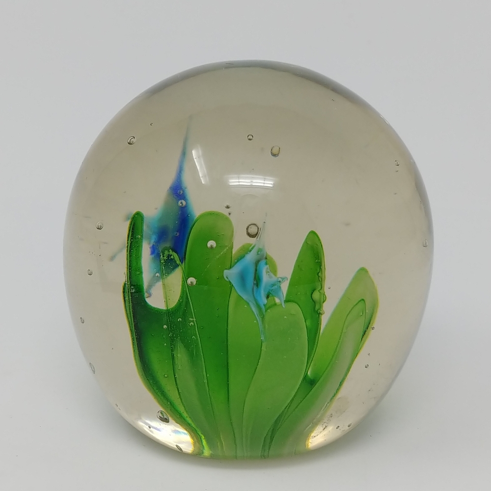 Clear glass paperweight with plants and fish